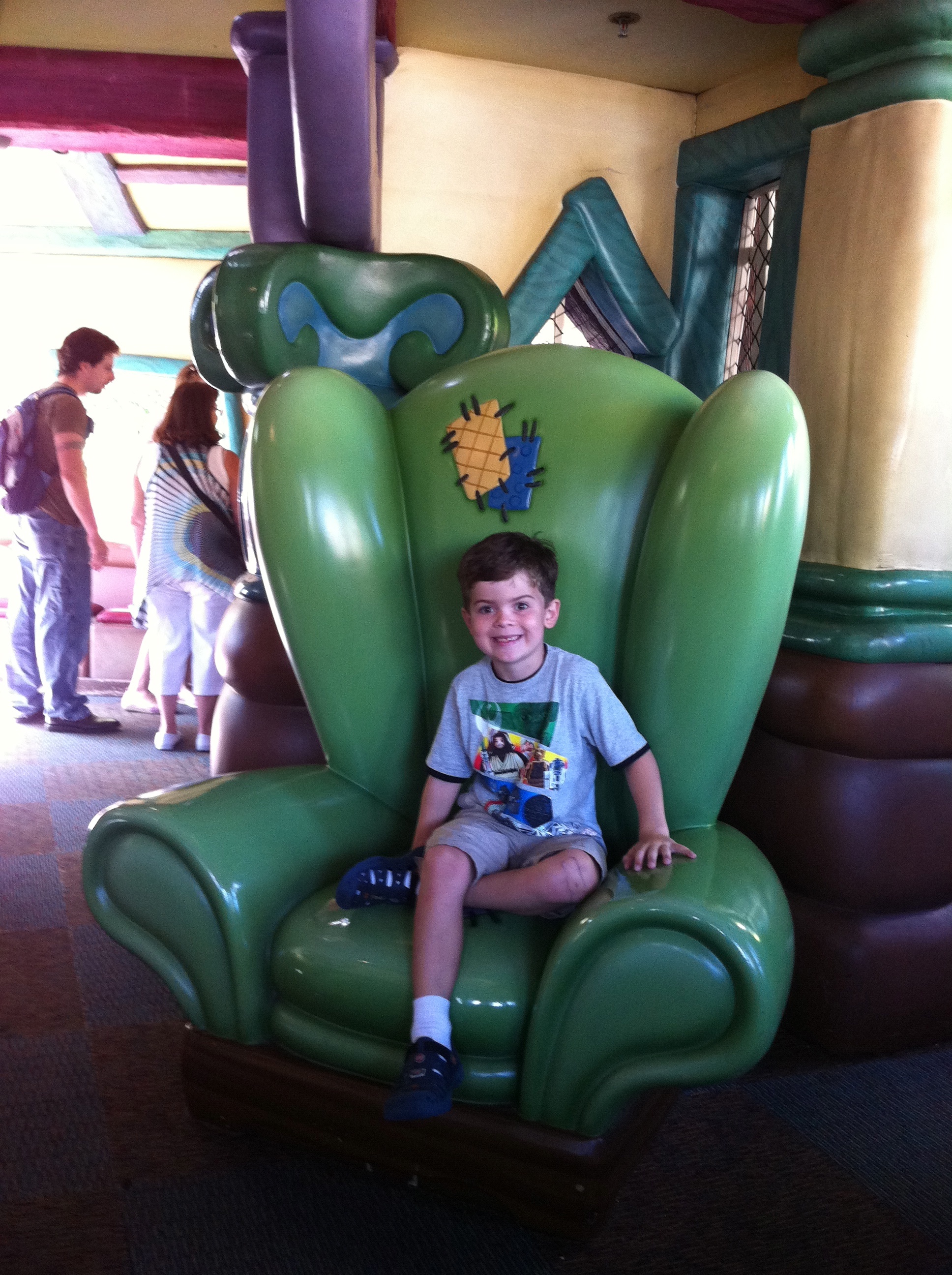 sitting in Goofy's chair.
