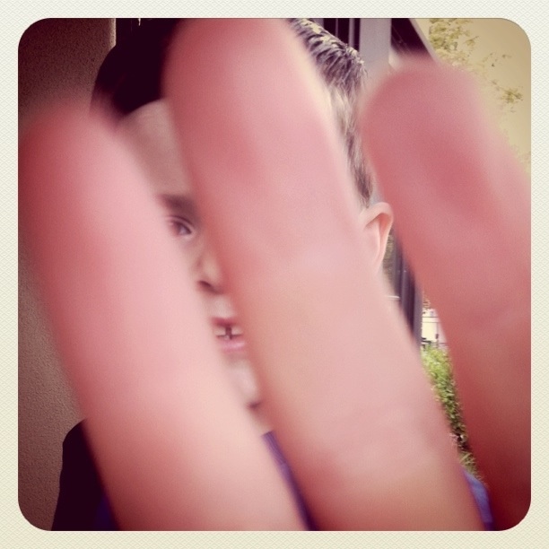 resisting having his photo taken